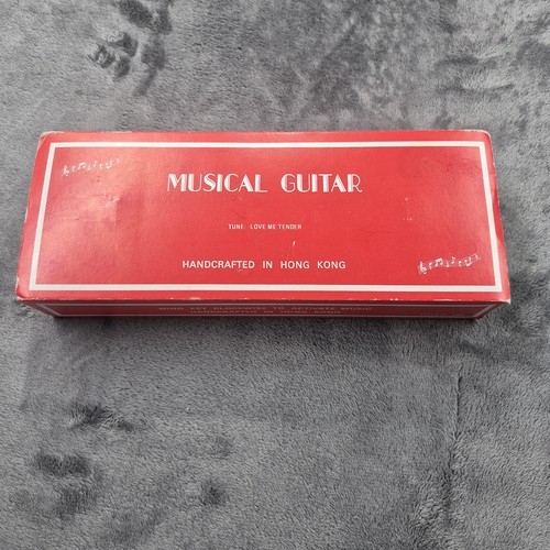 Vintage wind musical guitar - up,